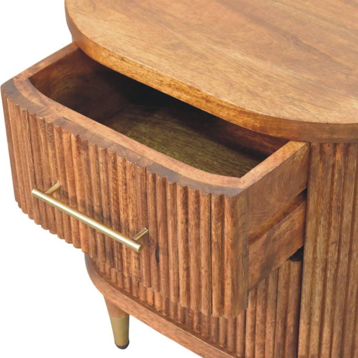 High-angle view showing the top drawer pulled open on an amber oak ribbed bedside table, revealing the wooden interior storage compartment.