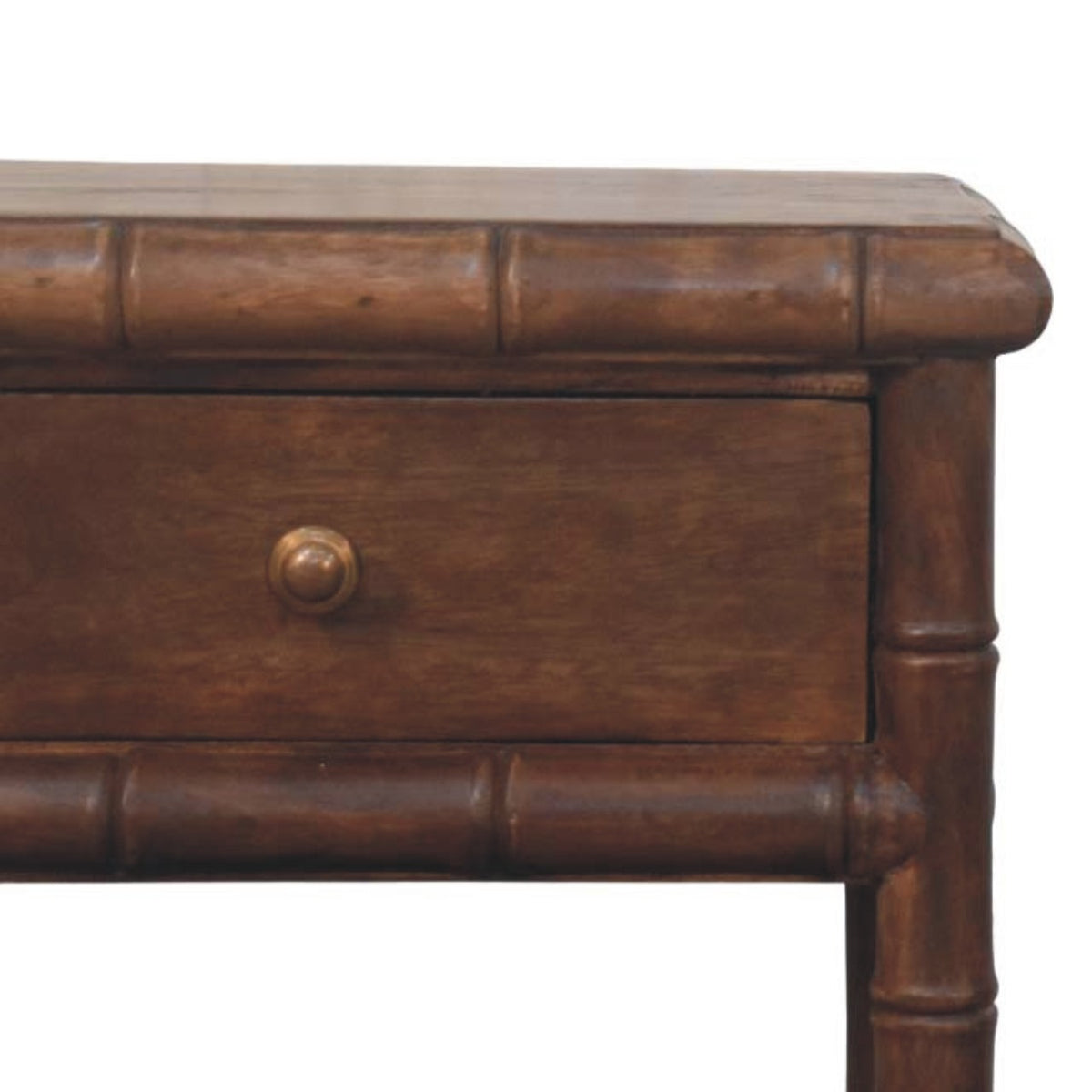 Close-up of a wooden nightstand with a bamboo-style design on a white background