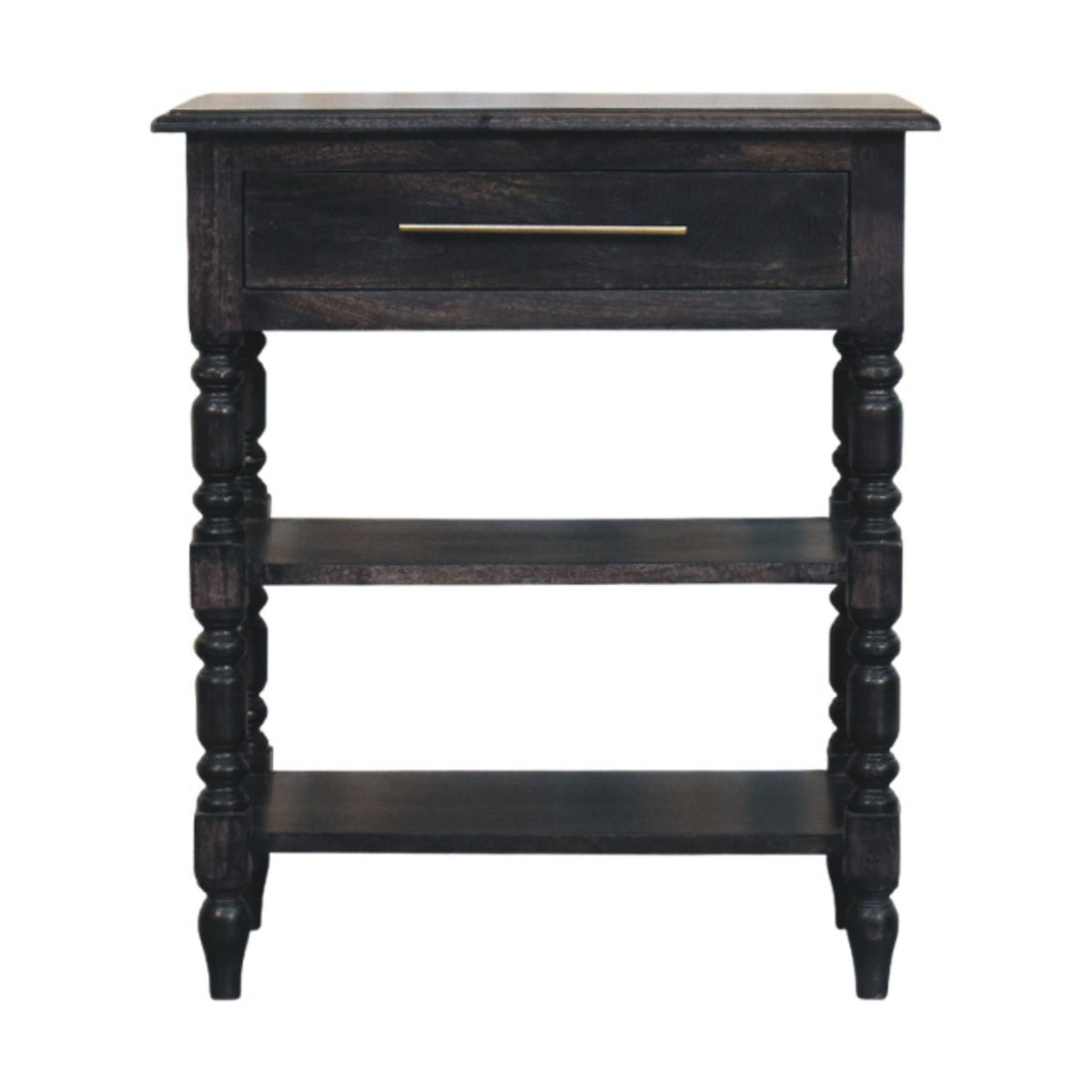 Front view of a solid mango wood turned-leg side table in a carbon ash finish, featuring a single drawer with a brass handle and two open lower shelves.