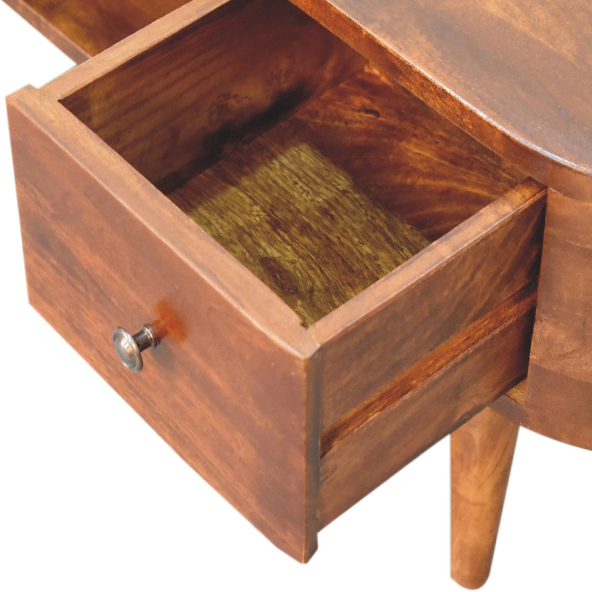 Wooden drawer of a media unit with a metal handle on a white background