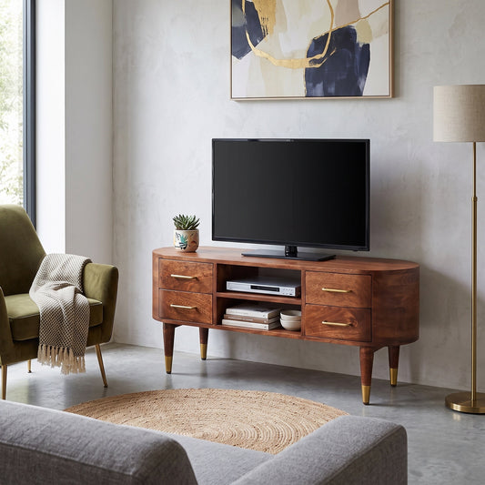 Curved 2-drawer media unit in solid mango wood, Winewood Oak finish – lifestyle setting