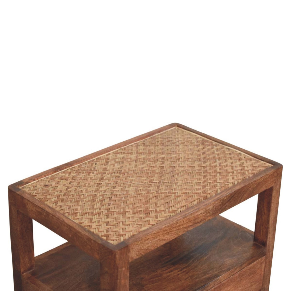 Elevated angled view showcasing the textured woven rattan top surface of a solid mango wood bedside table.