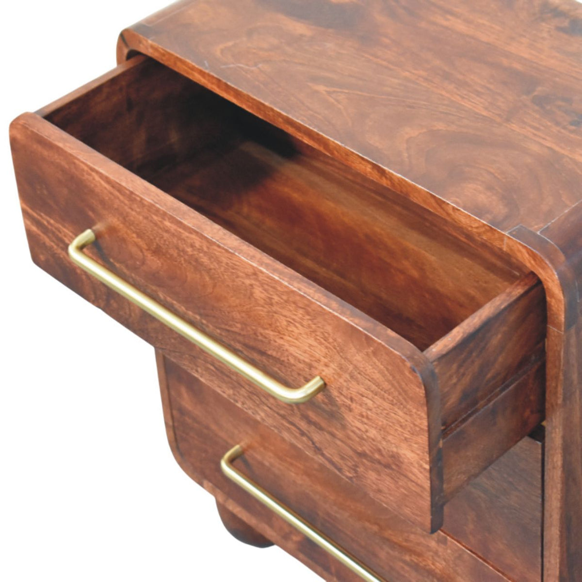 Wooden drawer of a chest with brass handle on a white background