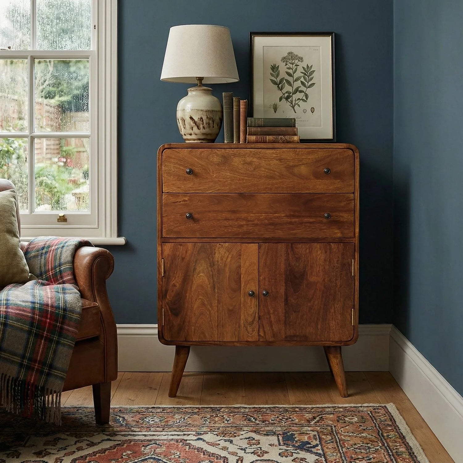 Solid mango wood curved cabinet in lifestyle – The Artisan Edit Cabinets collection