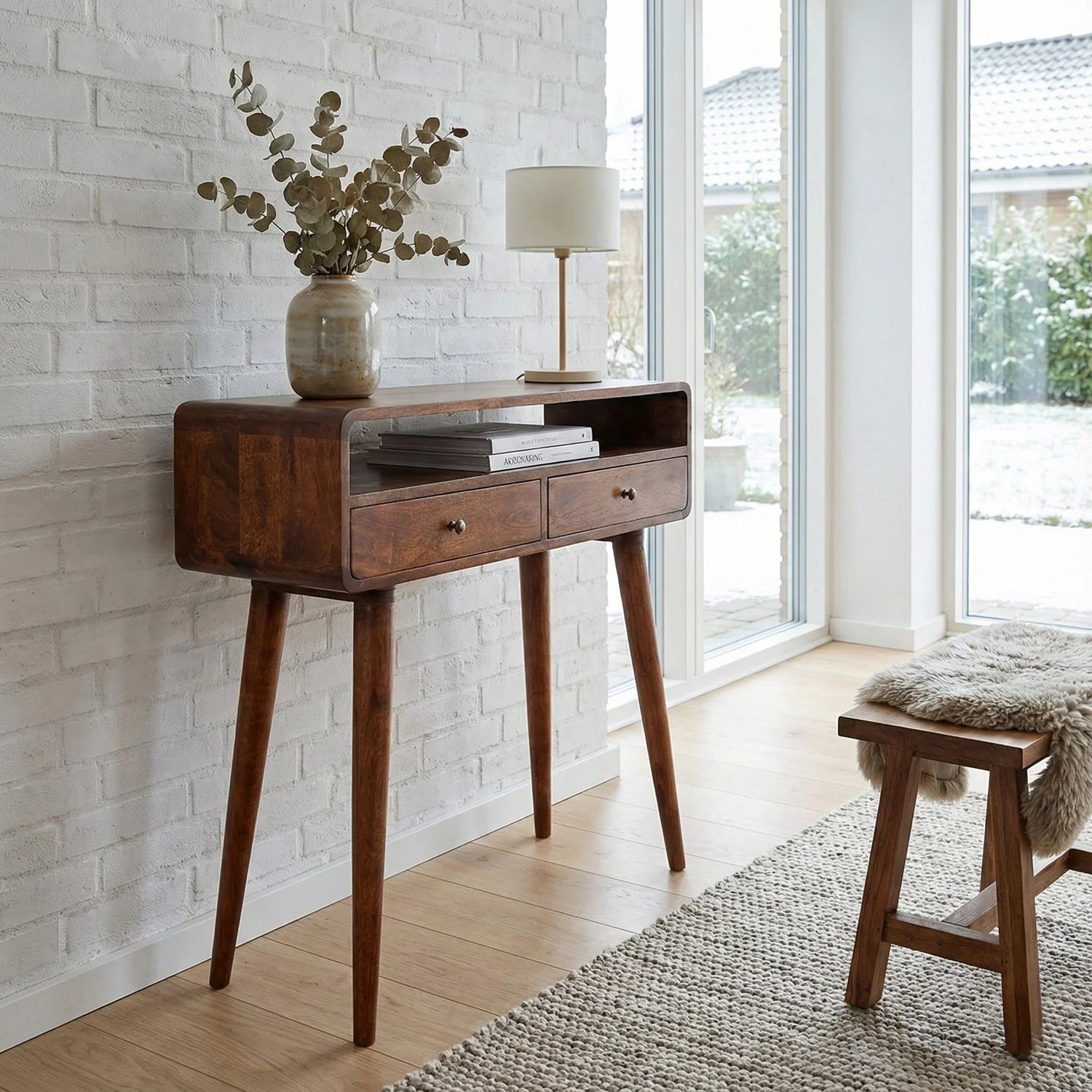 Solid mango wood curved console table in lifestyle – The Artisan Edit Console Tables collection