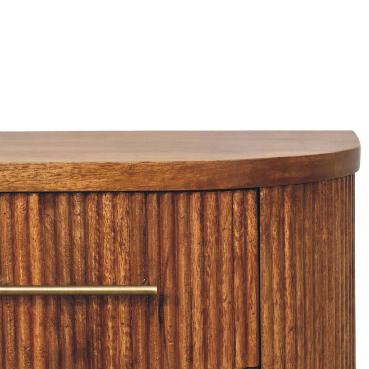 Close-up detail of the vertical ribbed wood texture and a sleek brass bar handle on an amber oak bedside table drawer.