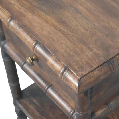 Wooden nightstand with a drawer and decorative legs on a white background
