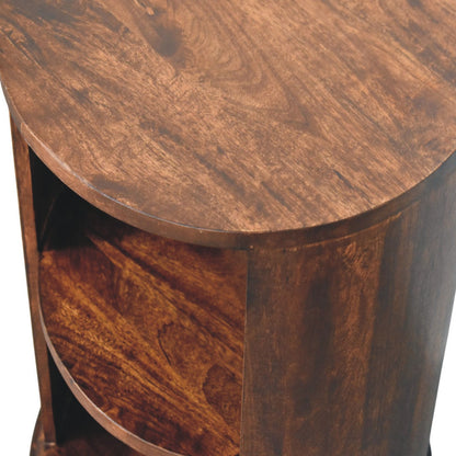 Close-up of a wooden side table with a round top and cylindrical base.