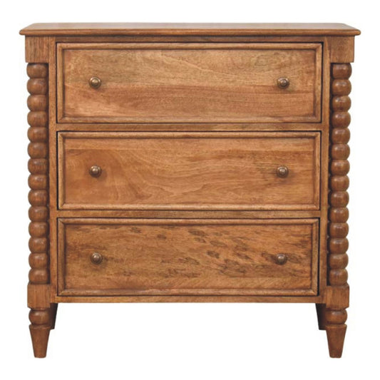 Front view of the Chest of Drawers showing 3 drawers with round knobs and carved spindle legs