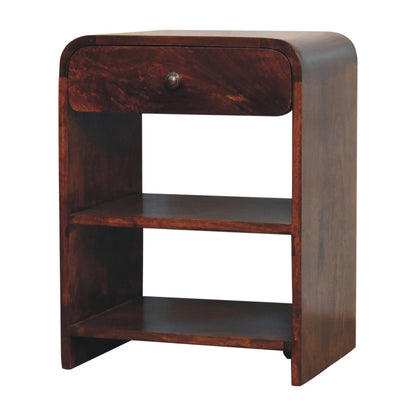 Angled left perspective of a chestnut finish bedside table showing the curved waterfall top edge extending down the sides.