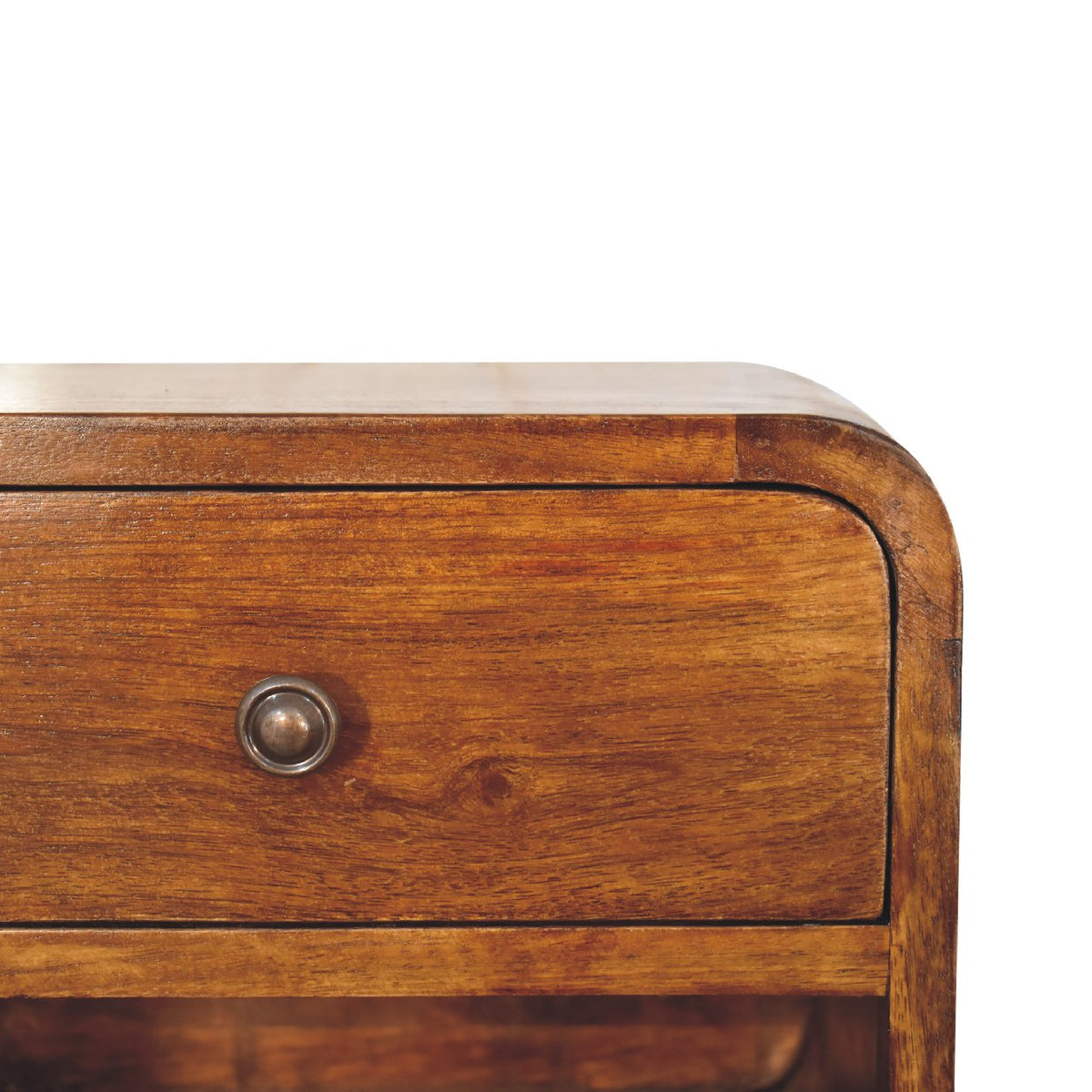 Close-up detail of the smooth rounded top right corner, rich wood grain, and small dark metal knob on a chestnut floating bedside table.