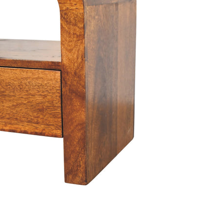 Lower right angle of Chestnut Nightstand showing open shelf and base