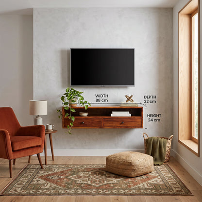 A floating wooden TV stand mounted on a textured light gray wall in a styled living room. A black flat-screen TV is mounted above the stand.