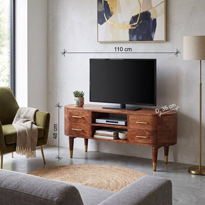 Curved 2-drawer media unit in solid mango wood, Winewood Oak finish – lifestyle view with measurements