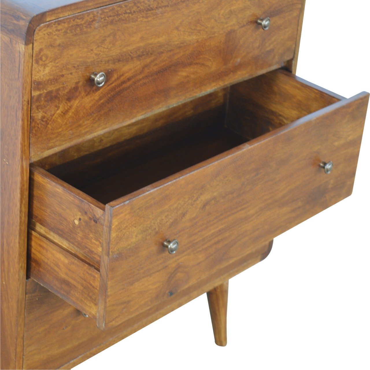 Close lower left angle of Curved Chestnut Chest Of Drawers with bottom drawer open showing interior storage