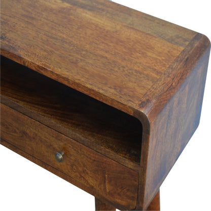 Close top right angle of Curved Chestnut Console Table showing natural mango wood grain and chestnut finish