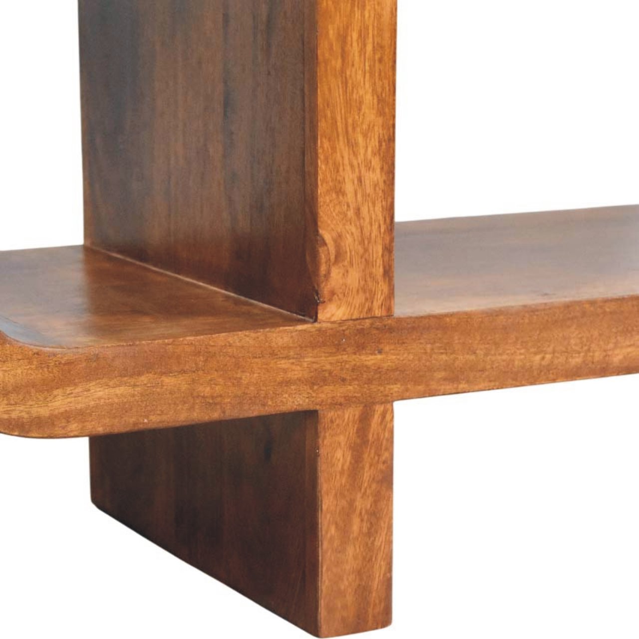 Close-up of a wooden shelf of the media unit with a white background