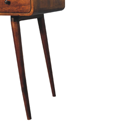 Lower right angle of Curved Chestnut Writing Desk highlighting Nordic-style legs