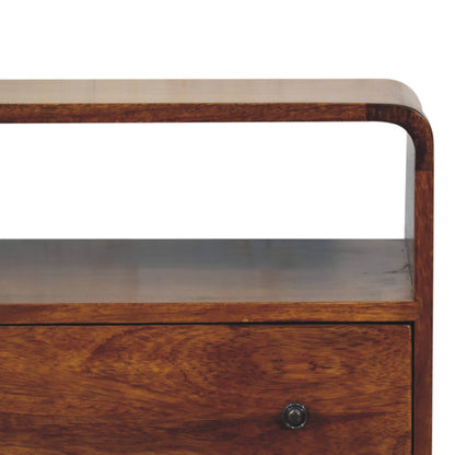 Close front right angle of Curved Nordic Charm Chest showing brass black knob and chestnut finish detail