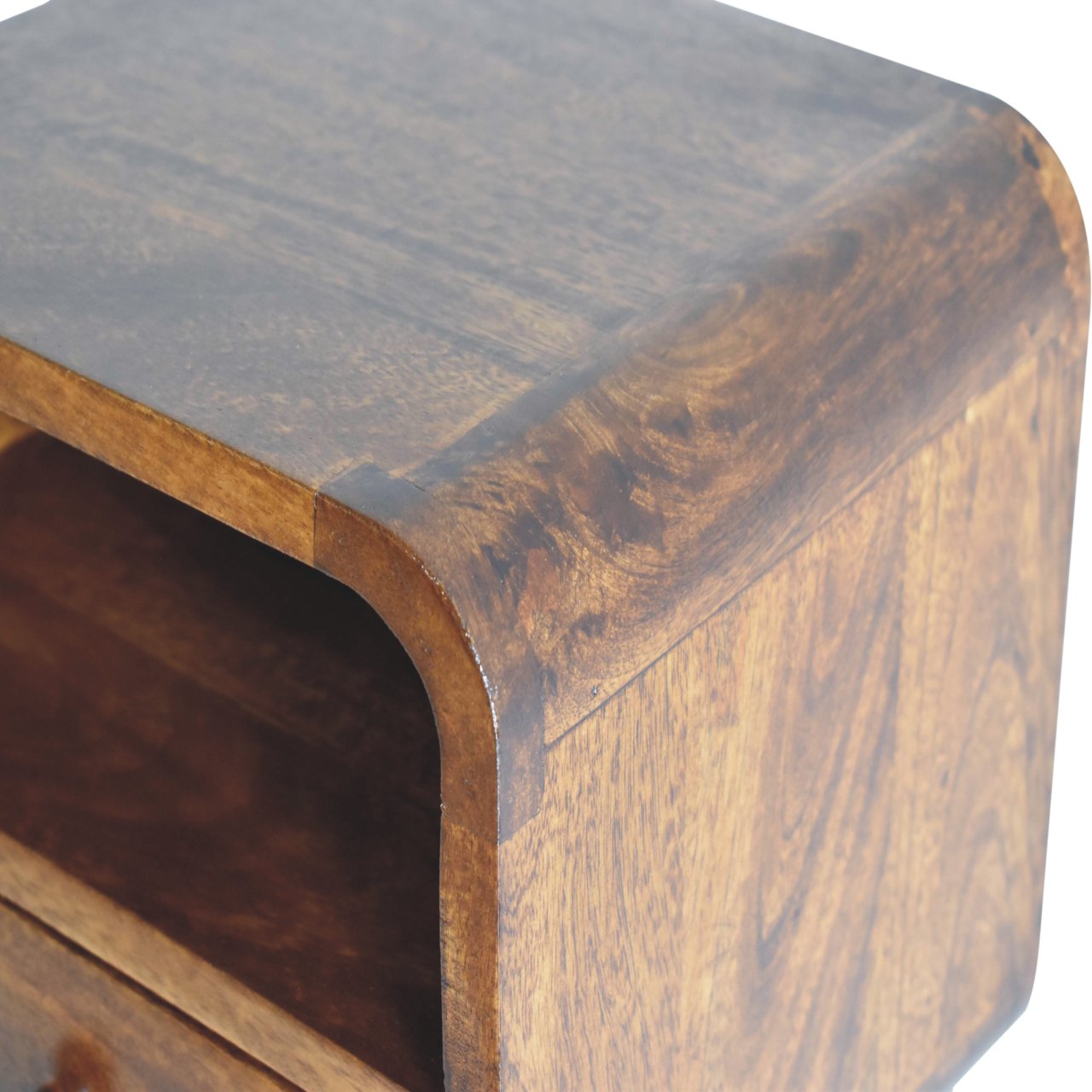 Close upper right angle of Extra Mini Wall Mounted Curved Chestnut Bedside showing mango wood grain and chestnut finish