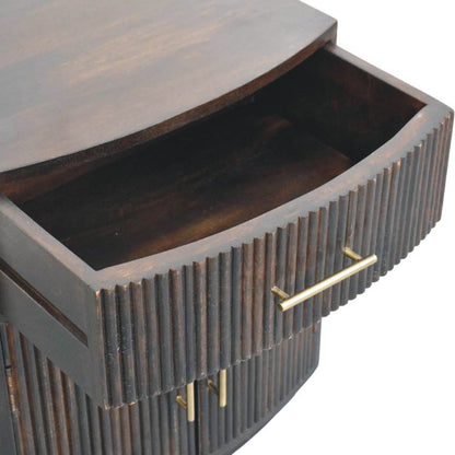 High-angle view showing the top drawer pulled open on a velvet mocha fluted bedside table, revealing the dark wooden interior storage compartment.