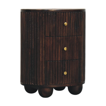 Angled left perspective of a fluted 3-drawer curved bedside table in a dark velvet mocha finish, highlighting its oval shape and ribbed texture.