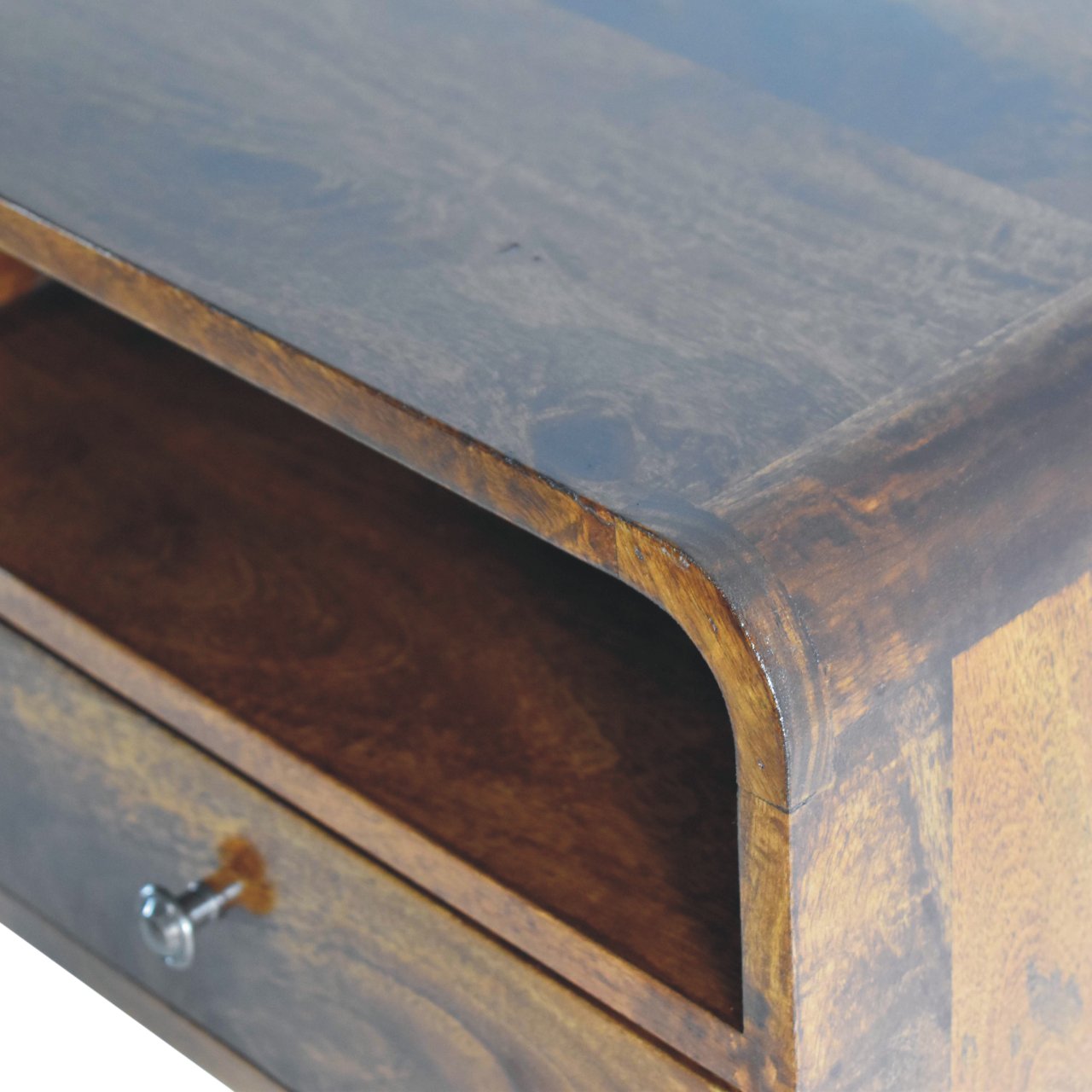 Close upper right angle of Large Chestnut Curve Floating Bedside showing mango wood grain and chestnut finish