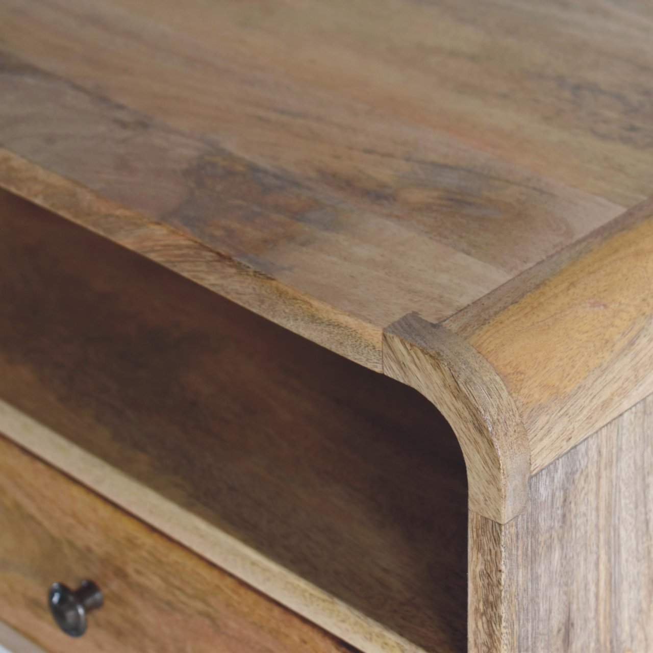 Close upper right angle of Large Oak Curve Floating Bedside showing mango wood grain and oak finish