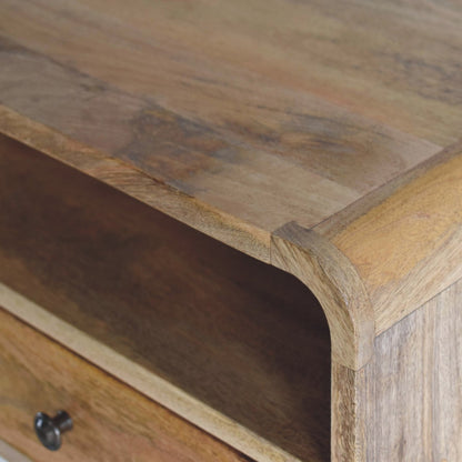 Close upper right angle of Large Oak Curve Floating Bedside showing mango wood grain and oak finish