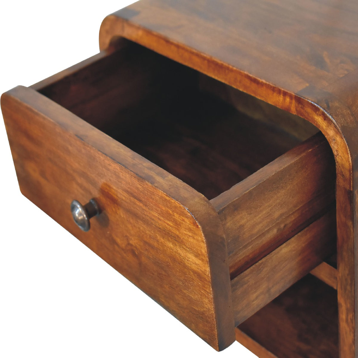 High-angle view showing the drawer pulled open on a chestnut solid mango wood floating bedside table, revealing the wooden interior compartment.