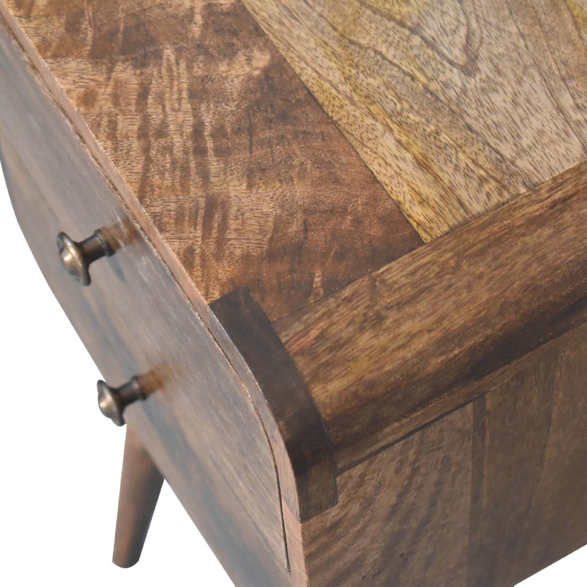 Close-up of a wooden nightstand with a checkered pattern on the top.