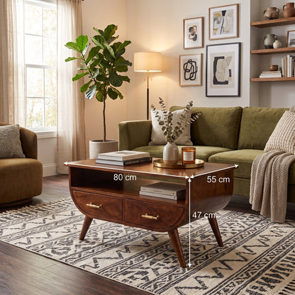 A mid-century modern wooden coffee table in a cozy living room setting, with dimension overlays showing its measurements of 80 cm length, 55 cm width, and 47 cm height.