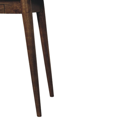 Close-up of legs of a writing desk on a white background