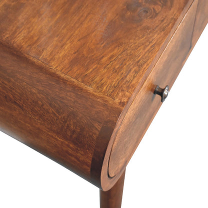 Close-up of a wooden vanity dressing table with a focus on the corner and drawer.