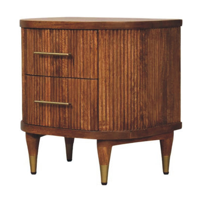 Angled right view of an amber oak finish bedside table with two ribbed drawers and brass-capped tapered legs.