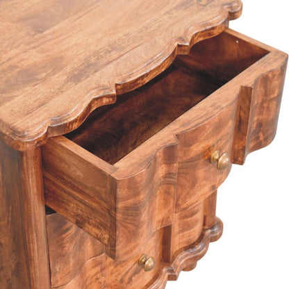 High-angle view showing the top drawer pulled open on a roasted almond solid mango wood bedside table, revealing the wooden interior compartment.