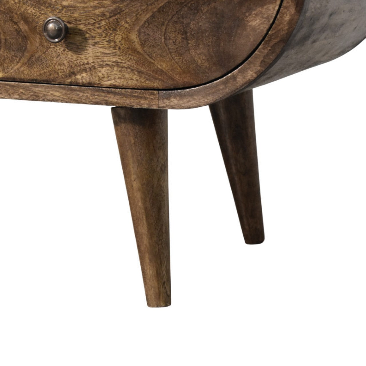 Close-up of a wooden media unit with a drawer and legs on a white background