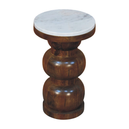 Wooden side table with marble top on a white background