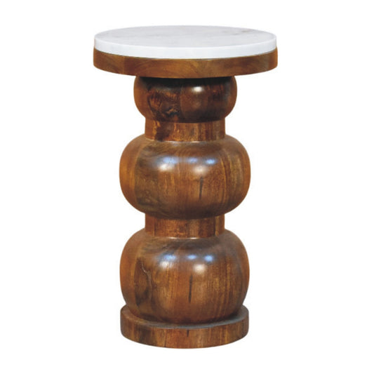 Wooden side table with a white marble top on a white background