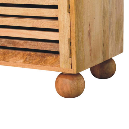 Close-up of a wooden shoe rack with spherical legs on a white background