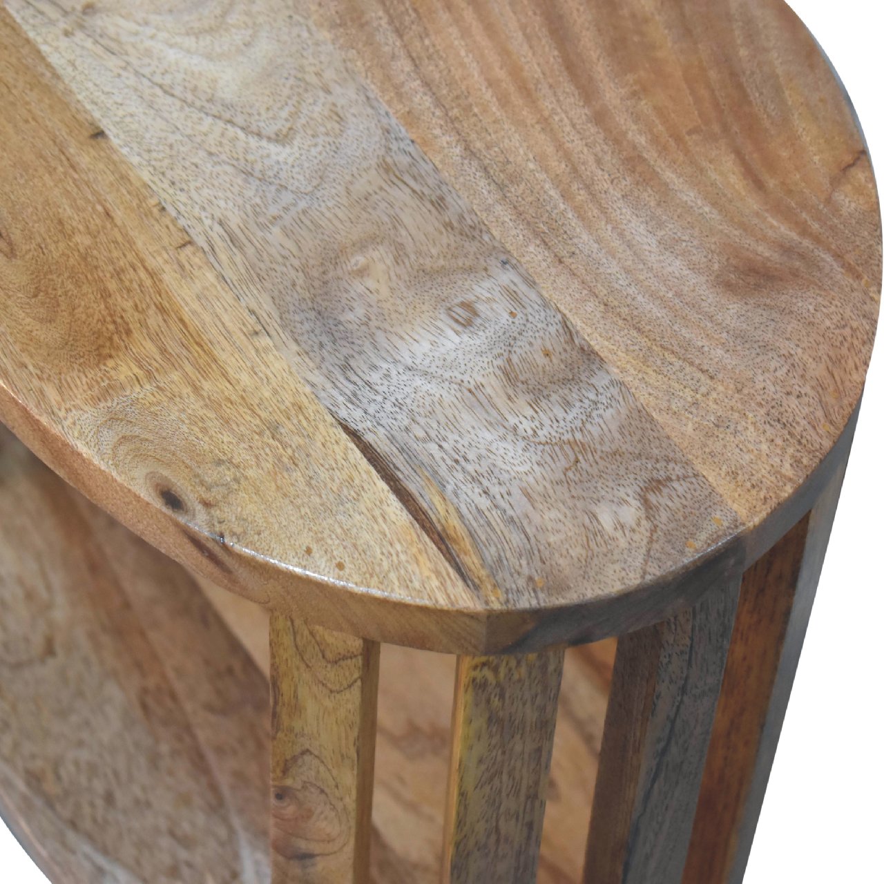 Close top-down view of Single Shelf Bedside showing mango wood grain and oak finish detail
