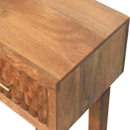 Wooden console table with a textured surface and geometric pattern.