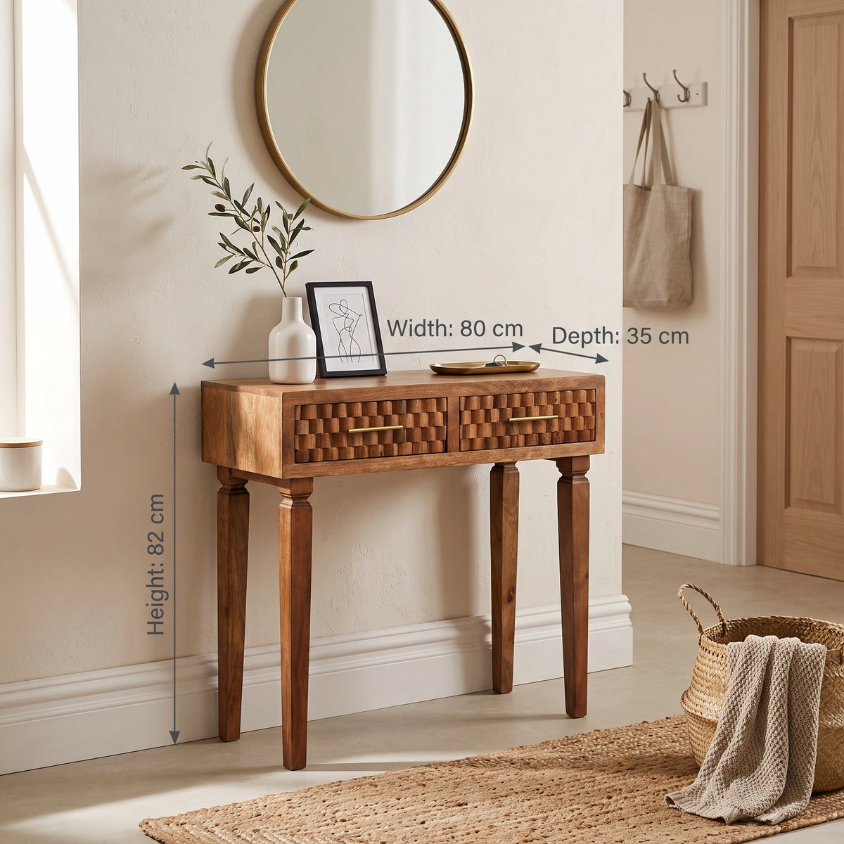 A wooden console table with two drawer fronts and tapered legs, shown in a styled entryway. White dimension arrows and text indicate width 80 cm, depth 35 cm, and height 82 cm.