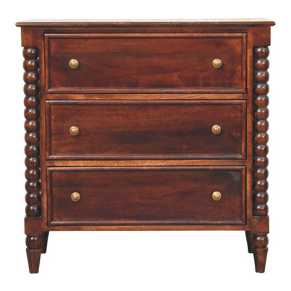 Front view of a solid mango wood 3-drawer chest in a Winewood Oak finish, featuring decorative spindle legs, framed drawer fronts, and brass knobs.