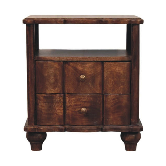 Front view of a solid mango wood bedside table in a roasted almond finish, featuring an open top shelf above two drawers with wavy textured fronts and round metal knobs.
