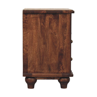 Straight-on side profile view of a solid mango wood bedside table in roasted almond, displaying a flat, smooth side panel.