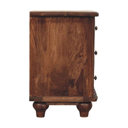 Straight-on side profile view of a solid mango wood bedside table in roasted almond, displaying a flat, smooth side panel.