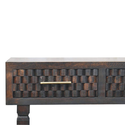 Dark wooden console table with textured surface and gold handle on a white background