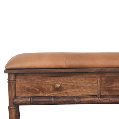 Wooden bench with a brown leather cushion on a white background