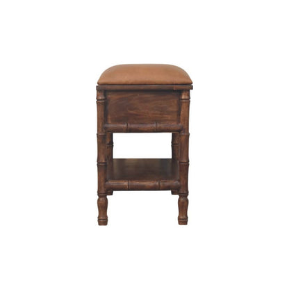 Wooden bench with a leather cushioned seat on a white background